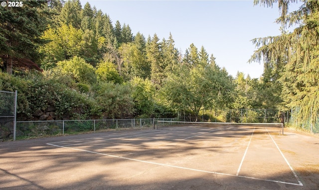 33423 Timber Ln, Eugene, OR 97405 - view of tennis court featuring a wooded view