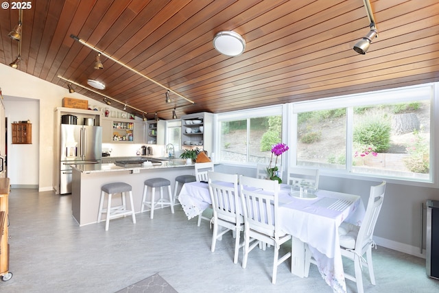 33423 Timber Ln, Eugene, OR 97405 - dining space with rail lighting, lofted ceiling, and wooden ceiling