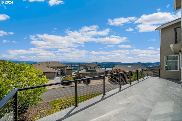 balcony with a mountain view and a residential view