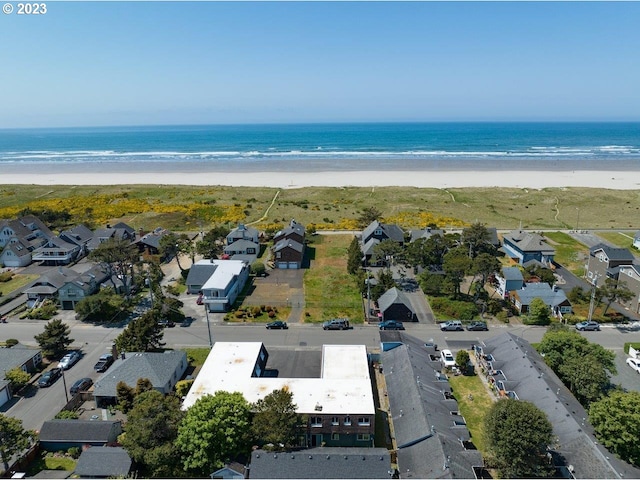 bird's eye view with a water view and a view of the beach