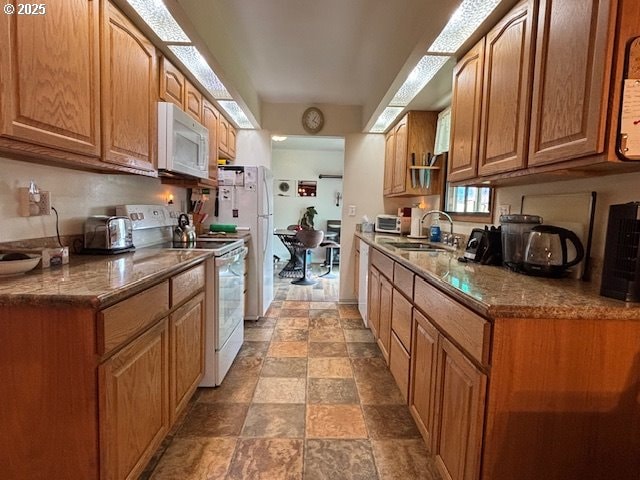 1676 NW Apache Dr, Roseburg, OR 97471 - kitchen featuring stone counters, white appliances, a sink, and stone finish flooring