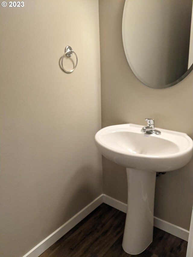 bathroom with wood-type flooring