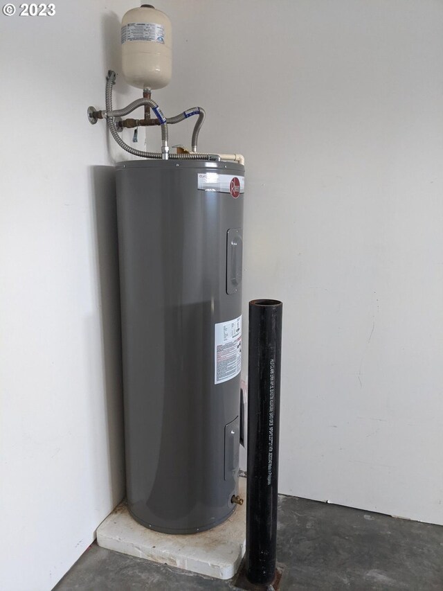 utility room featuring water heater