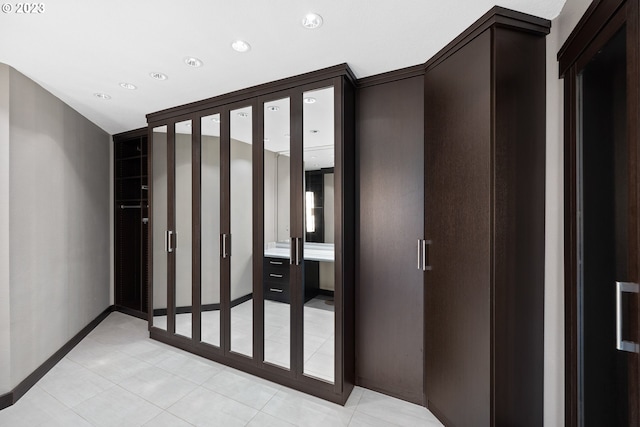 interior space with recessed lighting and baseboards