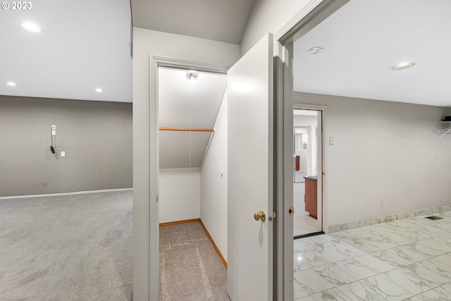 hallway featuring recessed lighting, baseboards, and marble finish floor