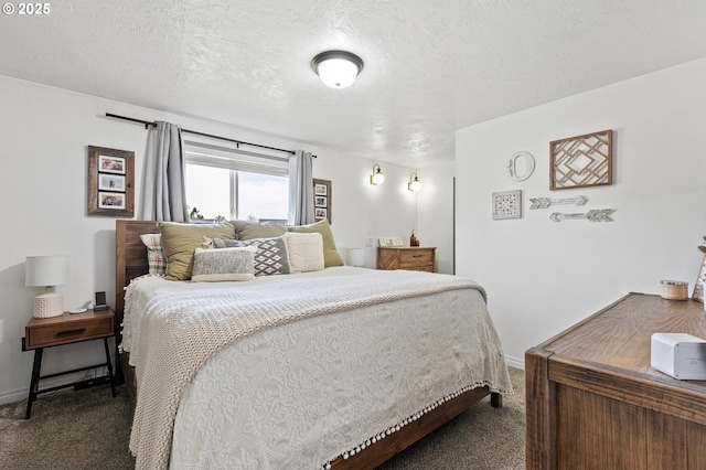 bedroom with dark colored carpet, a textured ceiling, and baseboards