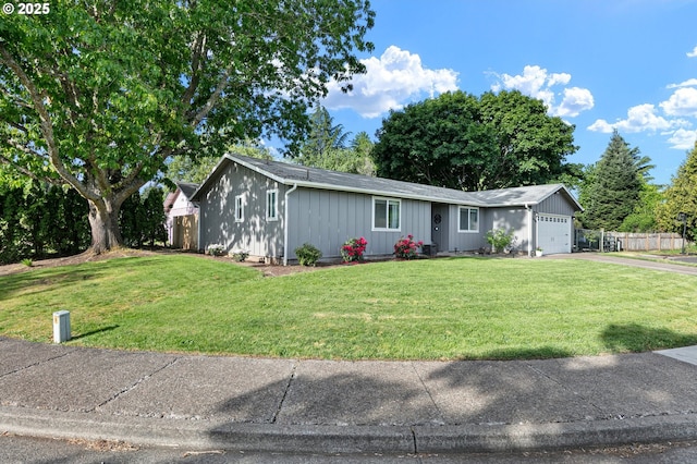 view of front facade featuring a garage, driveway, and board and batten siding