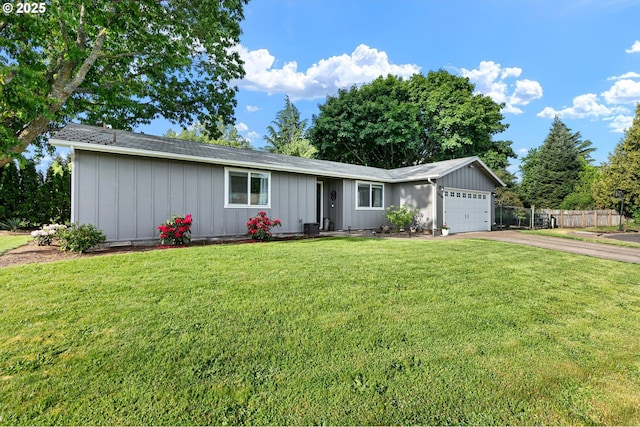 ranch-style house featuring board and batten siding, driveway, and a garage