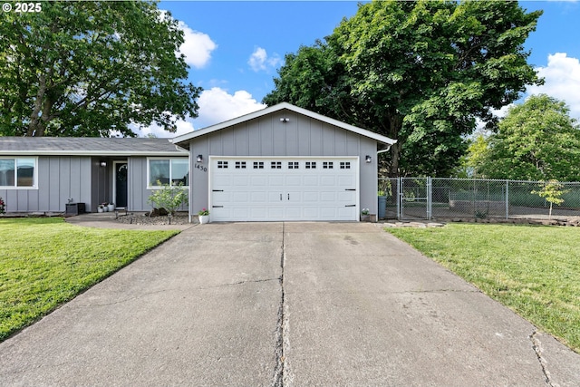 ranch-style house with board and batten siding, driveway, and a garage