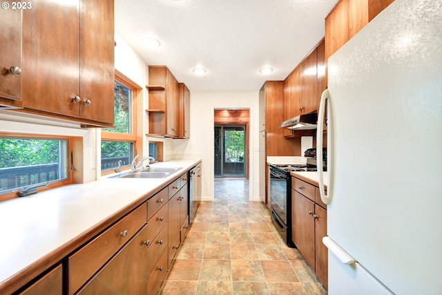 kitchen featuring white refrigerator, light tile floors, black electric range, dishwasher, and sink