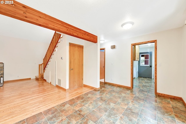 spare room featuring tile floors