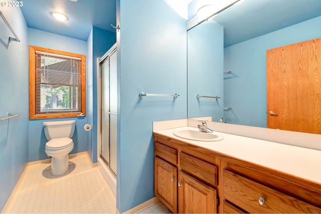 bathroom with walk in shower, toilet, tile floors, and oversized vanity