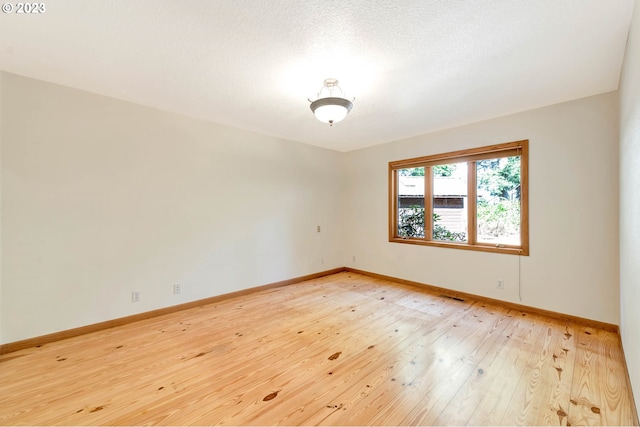 empty room featuring light hardwood / wood-style flooring