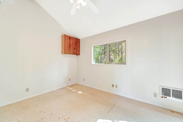 spare room featuring ceiling fan and lofted ceiling