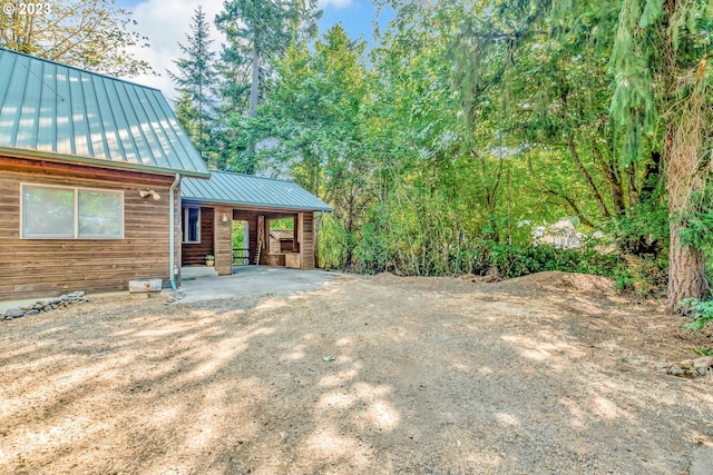 view of yard featuring a carport