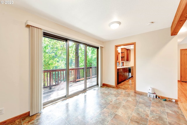 unfurnished room featuring light tile floors