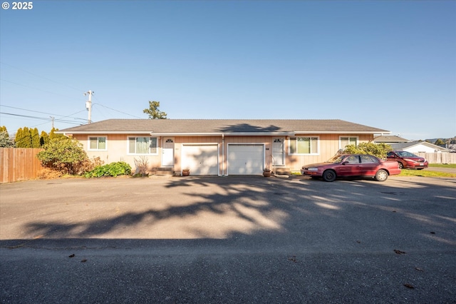 ranch-style home with a garage