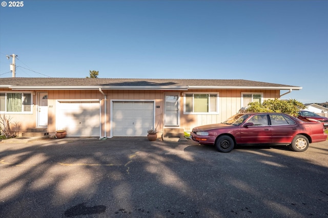 ranch-style house featuring a garage