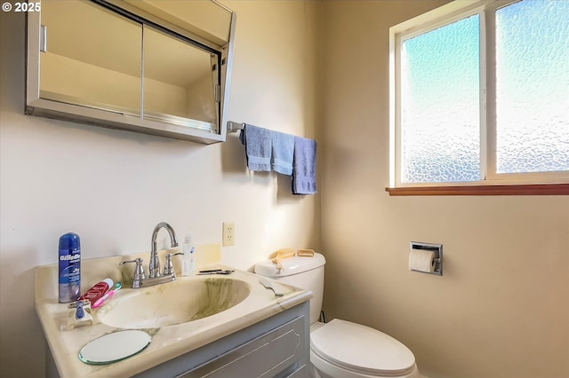 bathroom with vanity and toilet