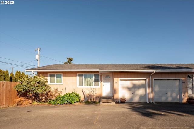 single story home featuring a garage