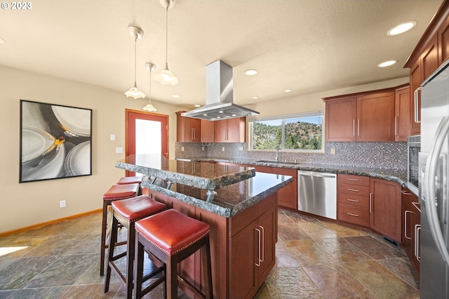 kitchen featuring island exhaust hood, a center island, appliances with stainless steel finishes, and tasteful backsplash