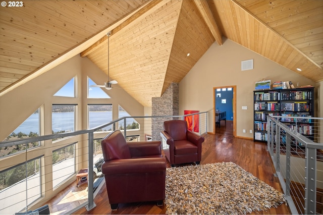 interior space with plenty of natural light, high vaulted ceiling, and dark hardwood / wood-style floors