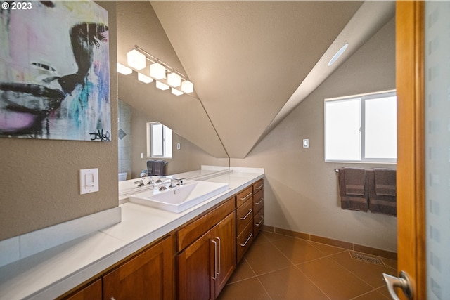 bathroom with tile flooring, vaulted ceiling, and vanity