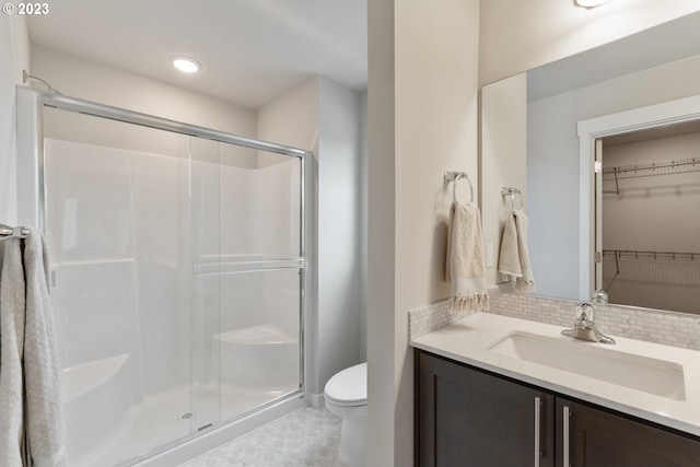 1647 N Millican Creek St, Lafayette, OR 97127 - bathroom with a shower stall, vanity, a spacious closet, and tasteful backsplash