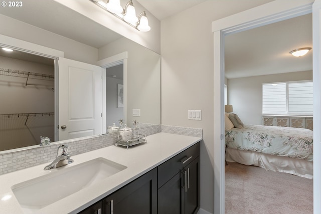 1647 N Millican Creek St, Lafayette, OR 97127 - bathroom with vanity, a spacious closet, and decorative backsplash