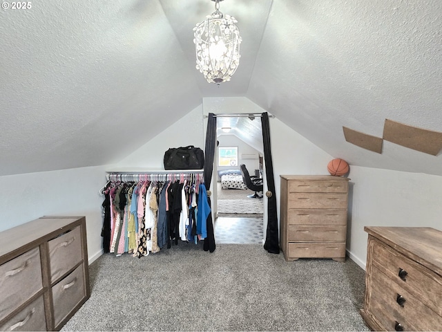 2951 NE Yount Ave, Roseburg, OR 97470 - walk in closet featuring carpet flooring, lofted ceiling, and a chandelier