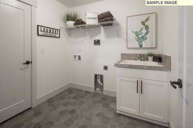 clothes washing area with washer hookup, sink, cabinets, and hookup for an electric dryer