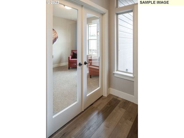 doorway to outside with french doors and hardwood / wood-style flooring