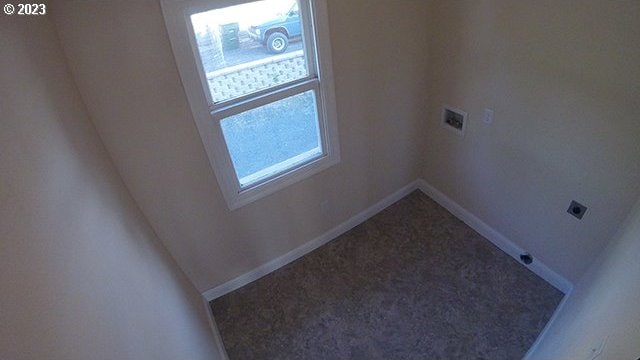 interior space featuring carpet, washer hookup, and electric dryer hookup