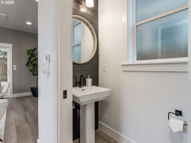 bathroom with recessed lighting, wood finished floors, and baseboards