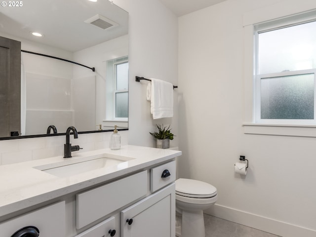 bathroom with visible vents, toilet, recessed lighting, baseboards, and vanity