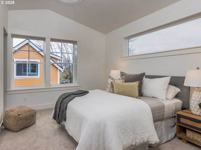 bedroom featuring vaulted ceiling, carpet flooring, and baseboards