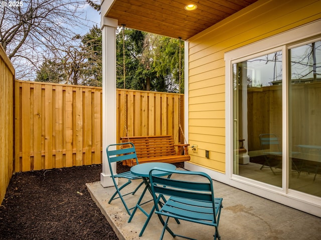 view of patio / terrace featuring fence