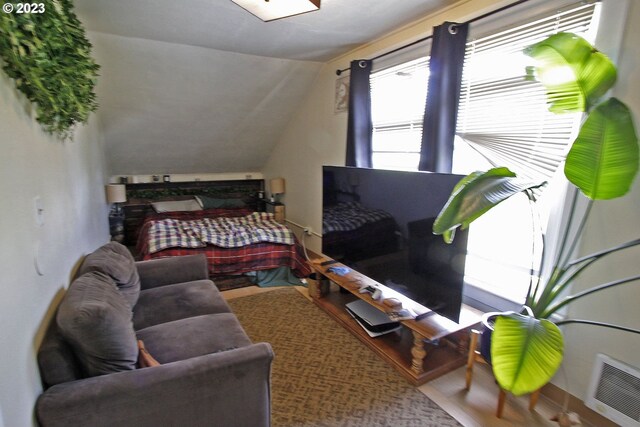 bedroom featuring vaulted ceiling