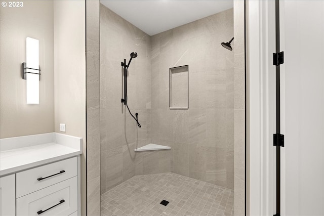 bathroom with a tile shower