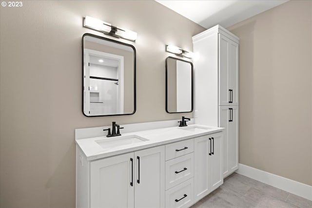 bathroom featuring tile patterned flooring and vanity