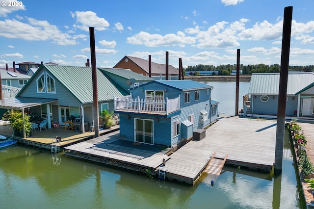 view of dock featuring a water view and a balcony