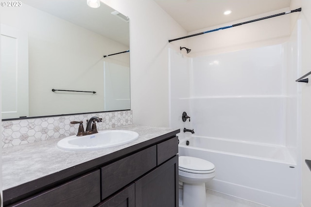 full bathroom featuring shower / bathtub combination, vanity, tasteful backsplash, and toilet