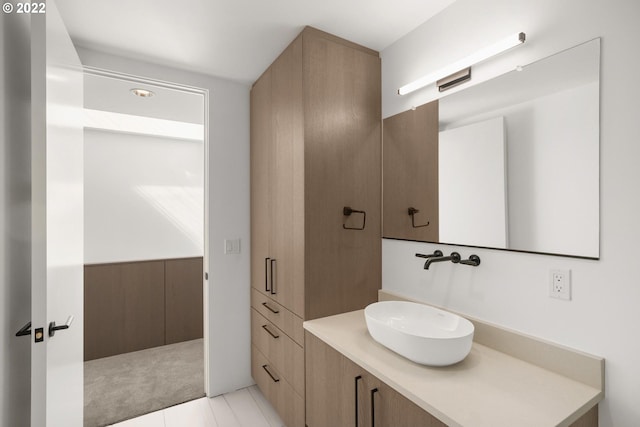 bathroom featuring tile flooring and large vanity