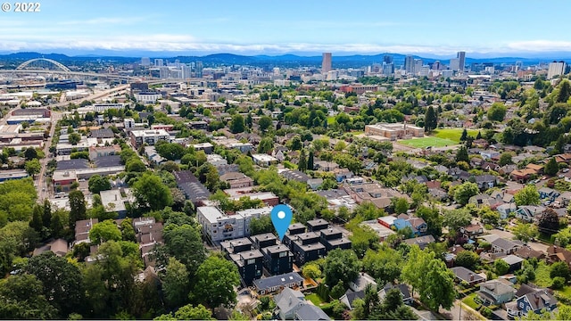 birds eye view of property with a mountain view