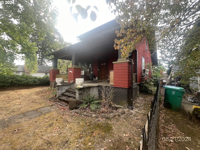 view of property exterior with fence