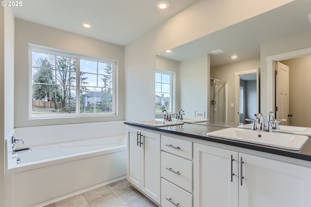 1717 Seven Mile Ln, Albany, OR 97322 - bathroom featuring double vanity, a stall shower, a garden tub, tile patterned flooring, and recessed lighting