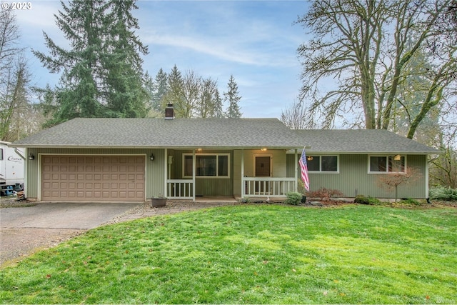 ranch-style house featuring a porch, a front yard, and a garage