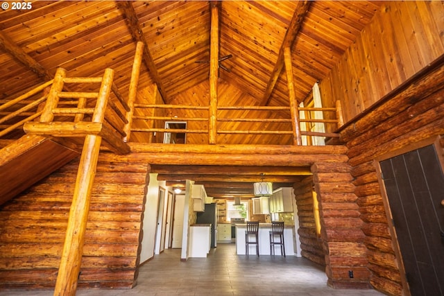17285 Rustic Ln, Brookings, OR 97415 - unfurnished living room featuring high vaulted ceiling, beam ceiling, and wood ceiling