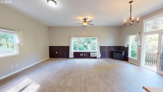 17285 Rustic Ln, Brookings, OR 97415 - unfurnished living room with a ceiling fan and plenty of natural light