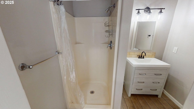 17285 Rustic Ln, Brookings, OR 97415 - full bath featuring a stall shower, wood finished floors, and vanity